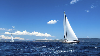 Fototapeta na wymiar Sailing on a calm sea. Boat race. Luxury yachts.