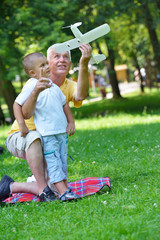 happy grandfather and child in park