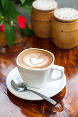 Cup of coffee latte on wooden