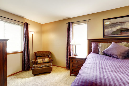Luxury bedroom furniture with bright purple bedding
