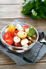 Caprese salad in a transparent bowl