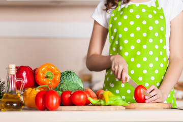 woman cooking dinner on the kitchen