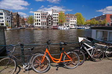 Fototapeta premium Amsterdam city with bikes on the bridge in Holland