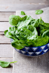 Baby spinach in a blue ceramic bowl