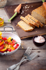 Red and yellow fresh tomato salad with bread
