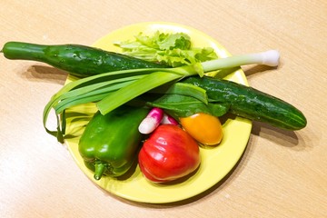 Fresh vegetables in yellow plate