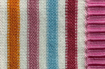 Knit woolen texture. Fabric striped background