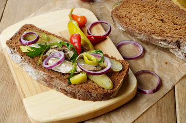 Sprat sandwich with pickled vegetables