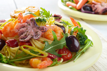 Seafood spaghetti pasta dish with octopus and shrimps