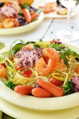 Seafood spaghetti pasta dish with octopus and shrimps