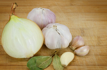 garlic and onion on cutting board