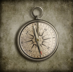 Fototapeta na wymiar old compass over vintage background