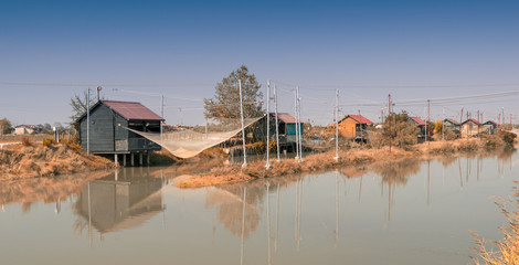 Fishing huts in Italy. People fish, cook and eat here