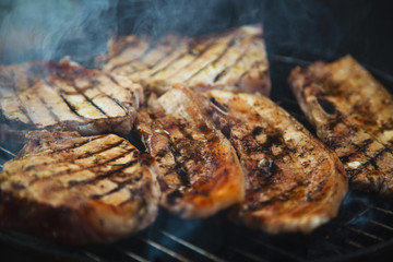 Grilled steaks on barbecue