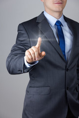 Business man touching an imaginary screen