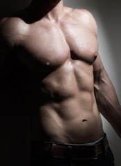 Naklejka premium Young muscular man torso
