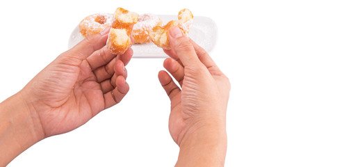 Female hand holding doughnuts over white background