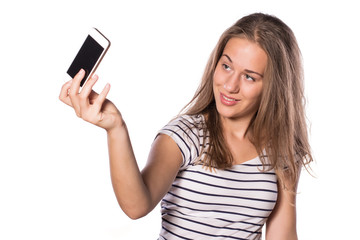 Fototapeta premium Pretty young girl making self-portrait with her phone