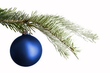 Blue Christmas ball on a snowy branch