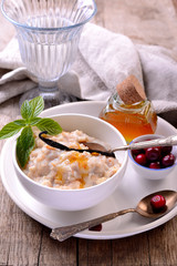 hot homemade milk oatmeal with natural vanilla and organic