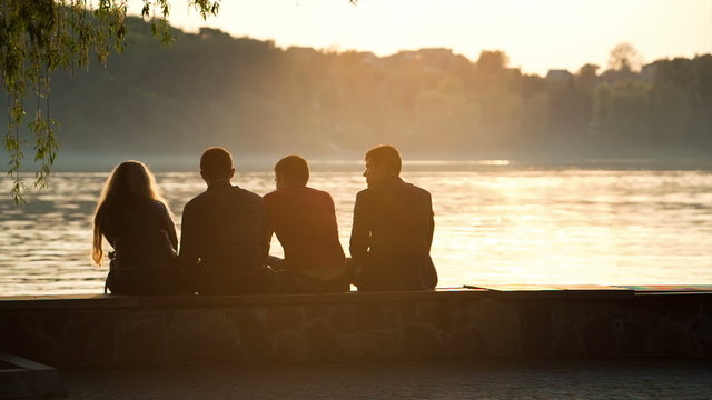 Four friends at sunset