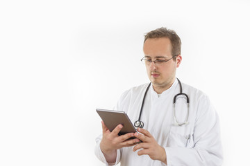Young Doctor looking at tablet