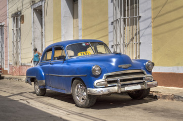 Fototapeta na wymiar Classic american old blue car in Trinidad, Cuba