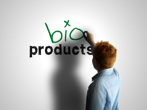 Bio products. Boy writing on a white board