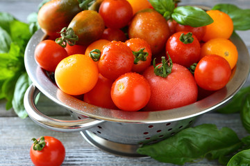 fresh tomatoes in a metal colander