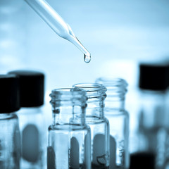 Laboratory research, dropping liquid to test tube