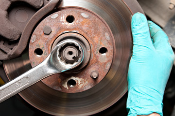 Man repairing a brakes
