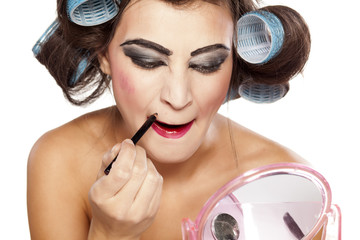woman with curlers and bad makeup