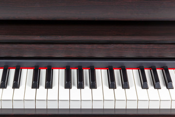 Fototapeta na wymiar Brown piano closeup