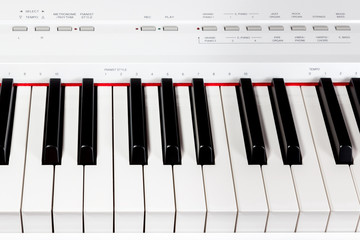Keys of digital white piano synthesizer
