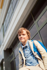 Portrait of happy schoolboy with  backpack