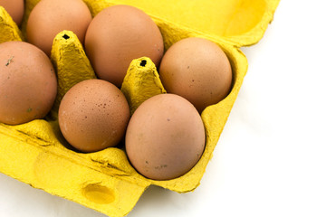 Eggs in the box isolated on white