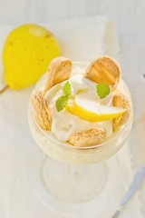 Dessert with pears, creamy cream and cookies
