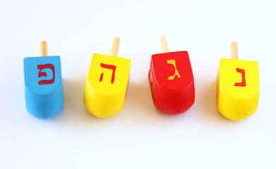 Wooden dreidels for hanukkah isolated on white background.
