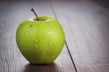 fresh green apple on the table