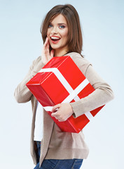 smiling woman hold red gift box.