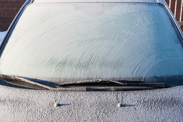 Snow-covered car windshield