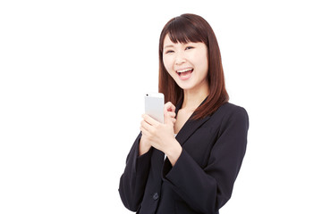 スマートフォンを持って喜ぶビジネスウーマン