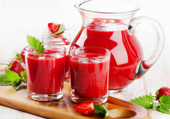 Strawberry fresh  smoothie with  berries on a wooden background