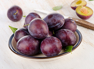 Sweet Plums on a  wooden table
