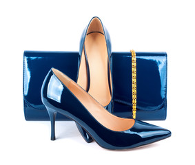 Beautiful blue shoes with clutches on white isolated background