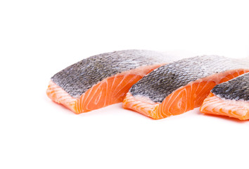 Fresh red salmon fillet slices.