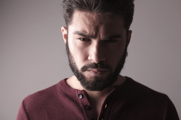 man wearing a sweater and looking at the camera