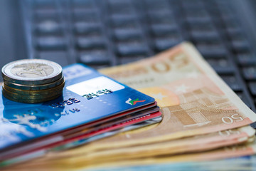 Money and creit card on keyboard