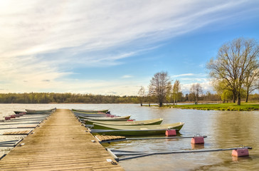Rowboats tied to a wooden pier