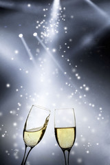 Glasses with champagne against fireworks
